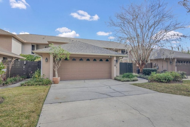 view of front of home with a garage and a front yard