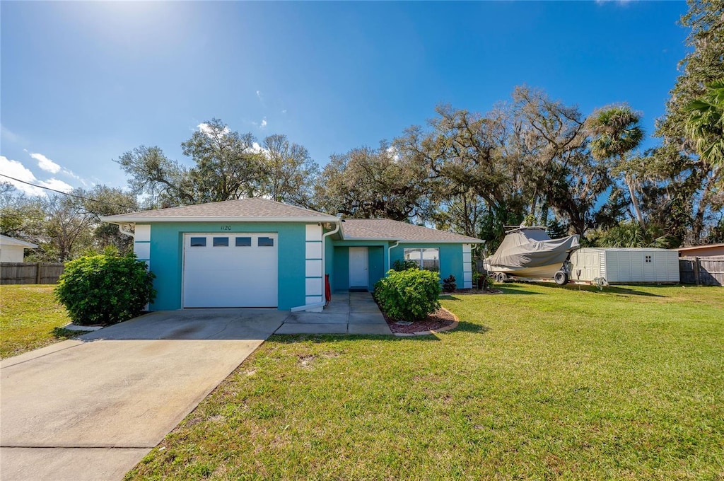 ranch-style house with a garage and a front yard