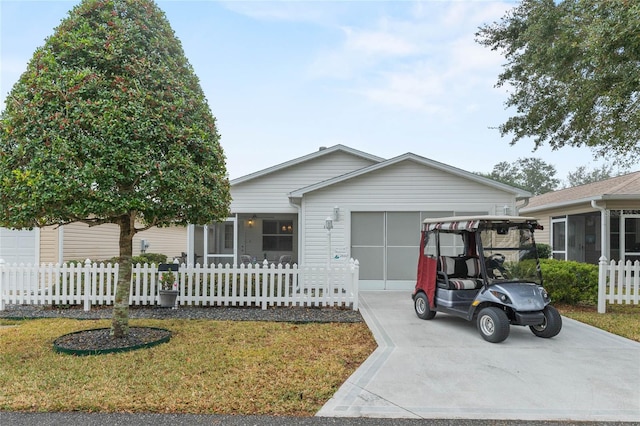 view of front of property with a garage and a front yard