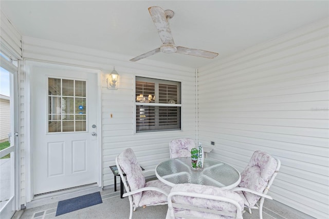 sunroom / solarium with ceiling fan