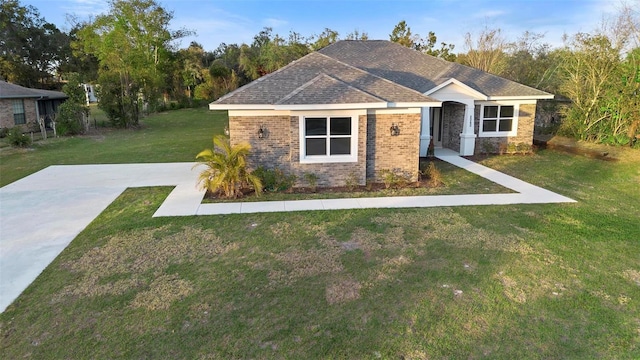 craftsman inspired home with a front lawn