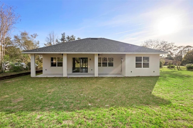 back of house with a yard, ceiling fan, and a patio area