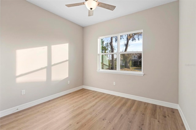 spare room with ceiling fan and light hardwood / wood-style flooring