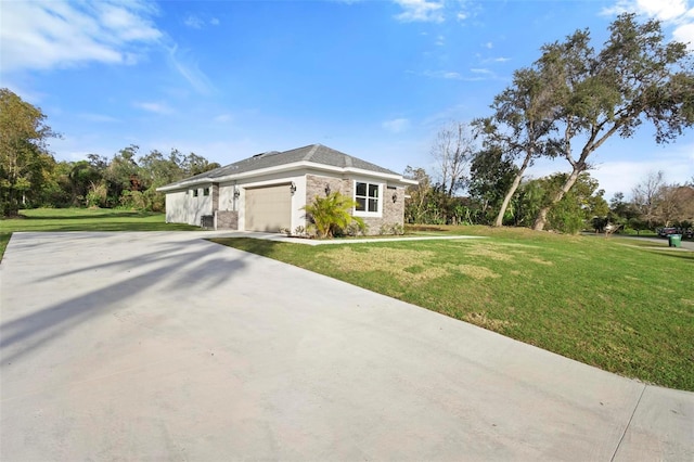 single story home featuring a garage and a front lawn