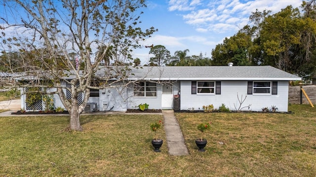 ranch-style house featuring a front lawn