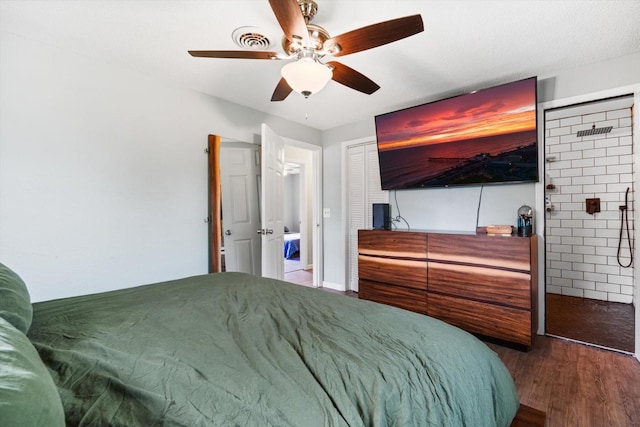 bedroom with ceiling fan and hardwood / wood-style floors