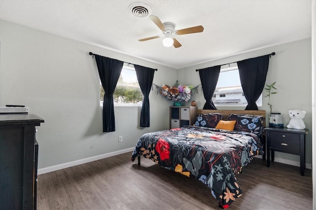 bedroom featuring dark wood-type flooring and ceiling fan