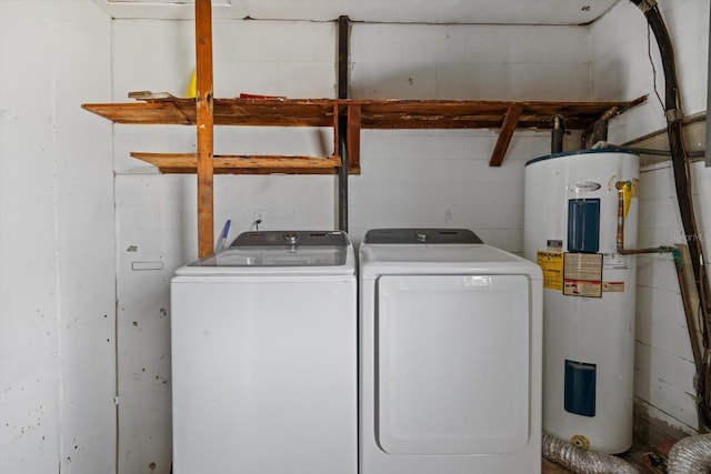 washroom featuring washer and dryer and electric water heater