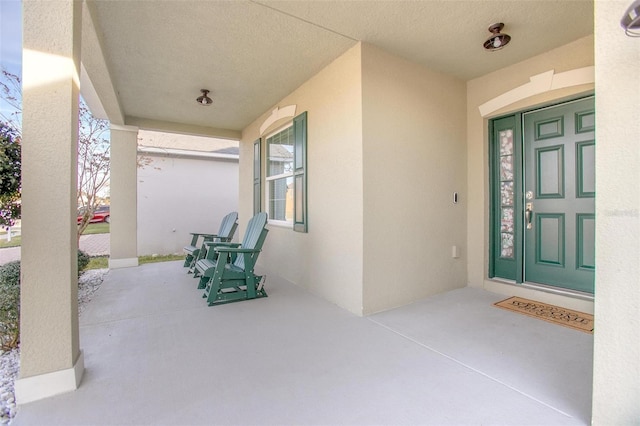 doorway to property with a porch