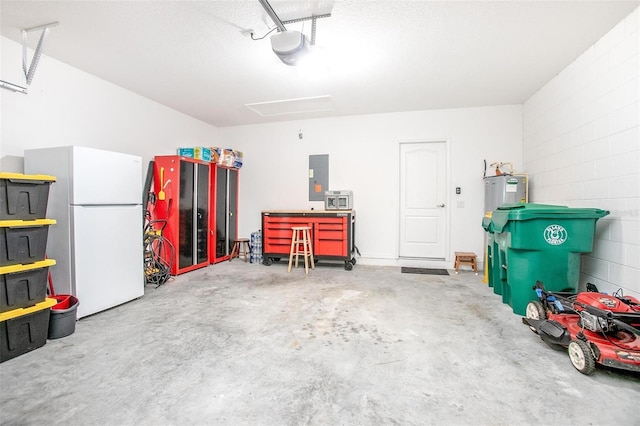 garage with a garage door opener, white fridge, and electric panel