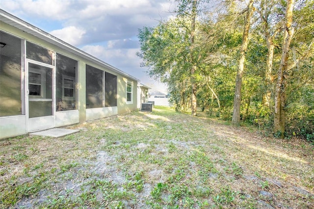 view of yard featuring central AC