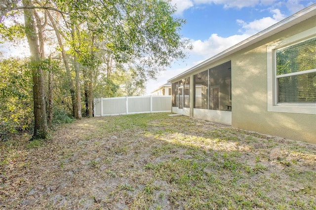 view of yard featuring a sunroom