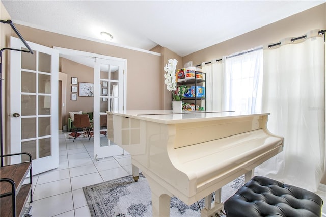 miscellaneous room featuring light tile patterned flooring and french doors