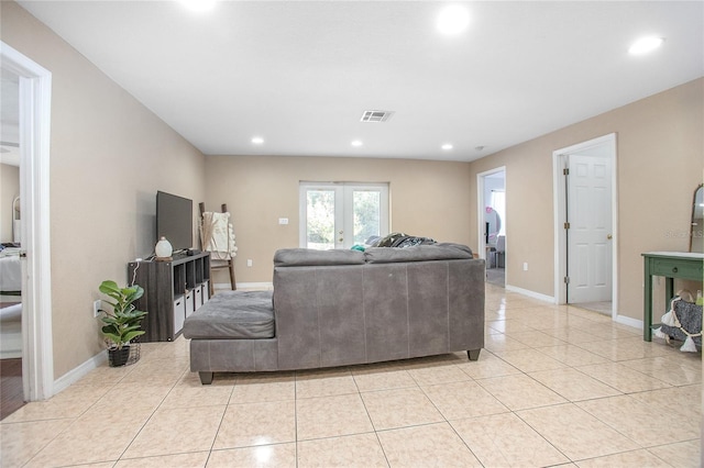 living room featuring light tile patterned flooring and french doors