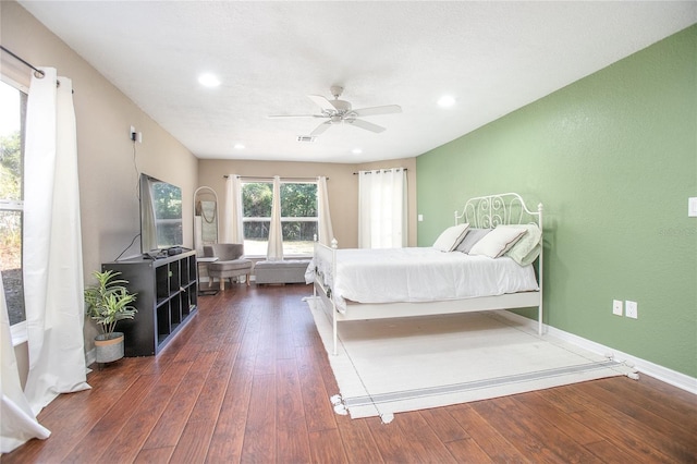 bedroom featuring dark hardwood / wood-style flooring and ceiling fan