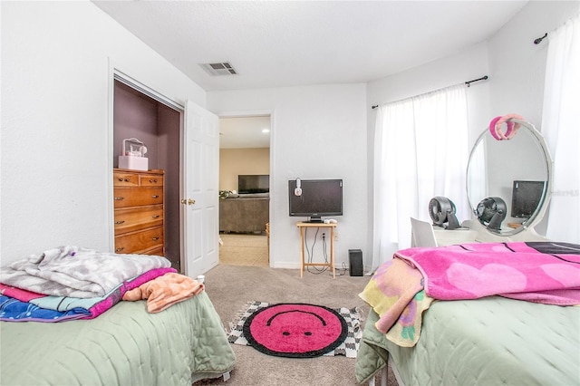 bedroom with light carpet