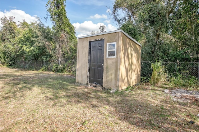 view of outdoor structure with a yard