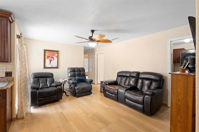 living room with ceiling fan