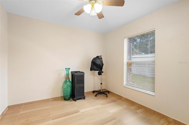 misc room featuring ceiling fan and light tile patterned flooring