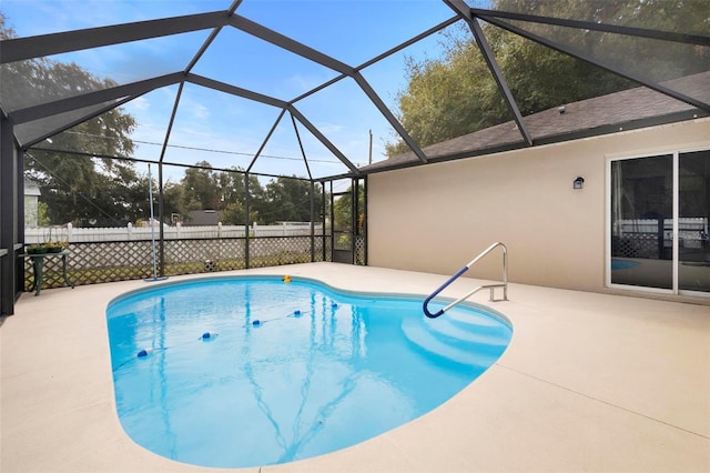 view of pool with a lanai and a patio area