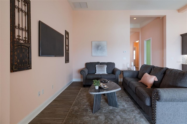 living room featuring dark hardwood / wood-style floors