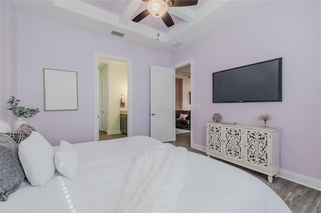 bedroom with dark hardwood / wood-style flooring, ensuite bath, ceiling fan, coffered ceiling, and beamed ceiling