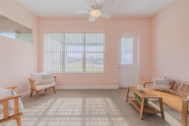 living area with ceiling fan