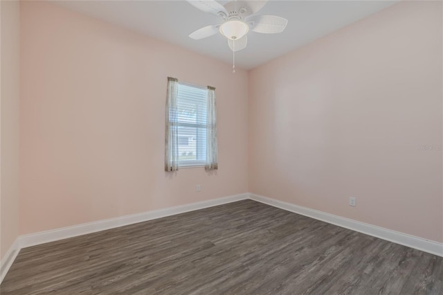 unfurnished room featuring dark hardwood / wood-style floors and ceiling fan