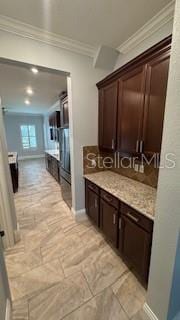 interior space featuring ornamental molding