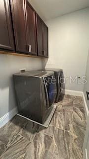 laundry room featuring cabinets