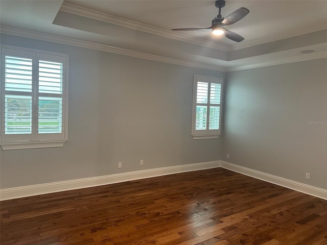 6301 Swanson St, Windermere, FL 34786 - unfurnished room featuring dark wood-style floors, a tray ceiling, baseboards, ceiling fan, and crown molding
