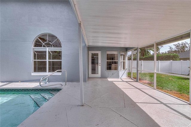 view of swimming pool featuring fence, a fenced in pool, and a patio