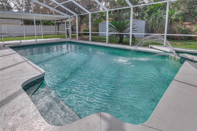 view of pool featuring a storage shed, a fenced in pool, a fenced backyard, a lanai, and an outdoor structure