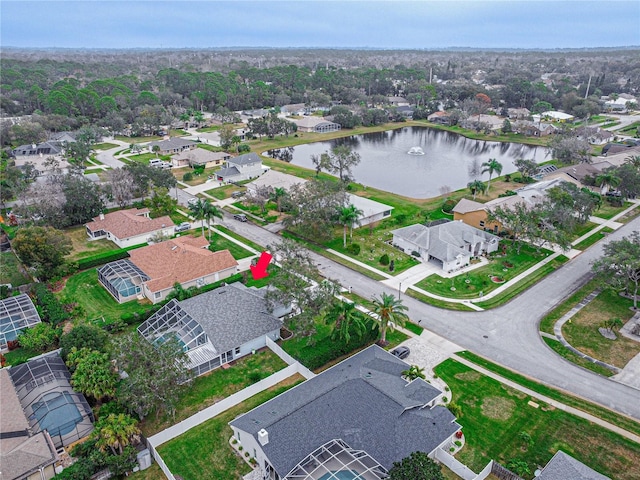 birds eye view of property with a water view and a residential view