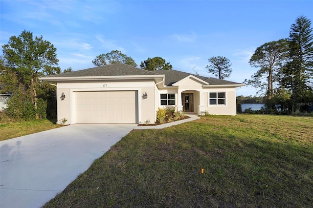 ranch-style house with a garage, driveway, a front lawn, and stucco siding