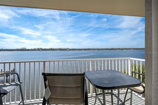 balcony featuring a water view