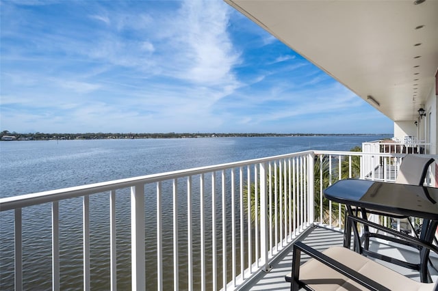 balcony featuring a water view