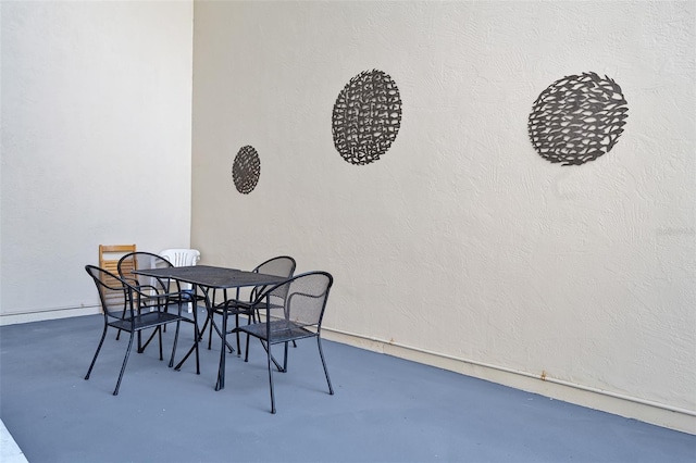 dining room featuring concrete flooring