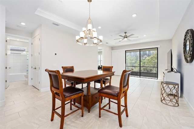 dining space with a tray ceiling