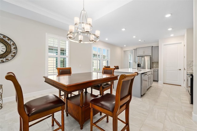 dining space featuring an inviting chandelier