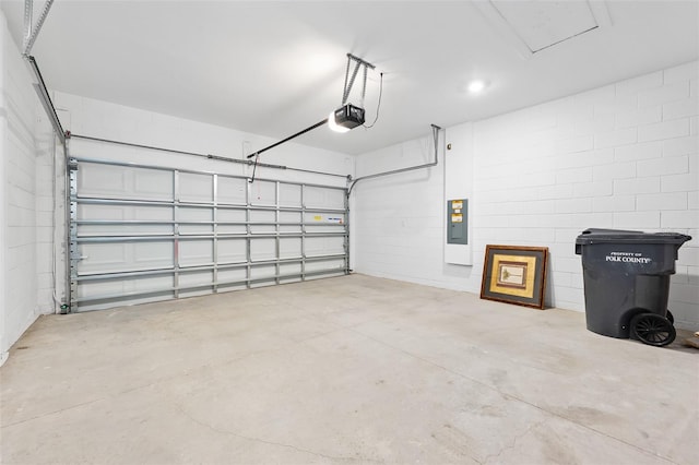 garage featuring a garage door opener and electric panel