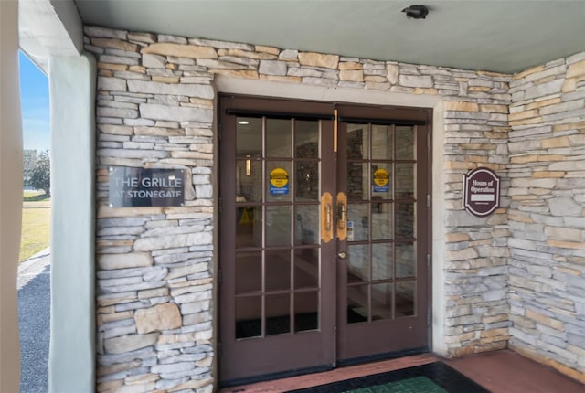 property entrance featuring french doors