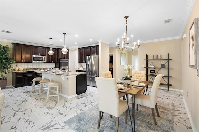 dining area featuring crown molding, sink, and a notable chandelier