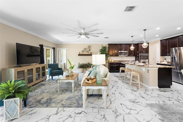 living room with crown molding, ceiling fan, and sink