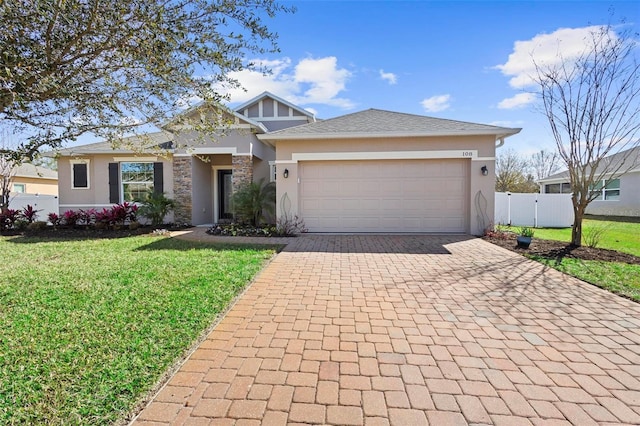 view of front of house with a garage and a front lawn