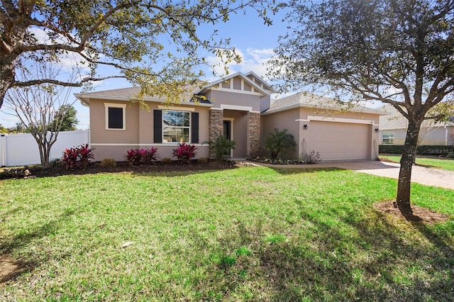 view of front facade with fence, a front lawn, stucco siding, an attached garage, and driveway