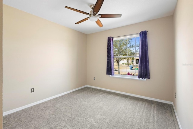 empty room featuring carpet flooring, baseboards, and ceiling fan