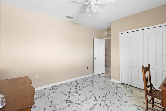 unfurnished bedroom with marble finish floor, baseboards, visible vents, and a closet