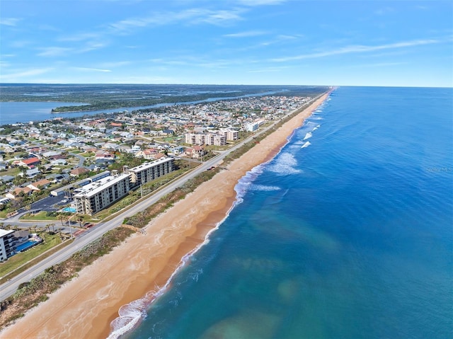 aerial view featuring a water view and a beach view