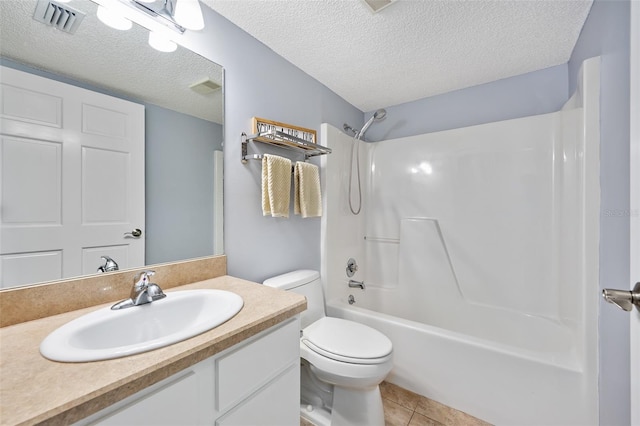3180 Ocean Shore Blvd Unit 309, Ormond Beach, FL 32176 - bathroom featuring a textured ceiling, toilet, vanity, tile patterned flooring, and shower / washtub combination